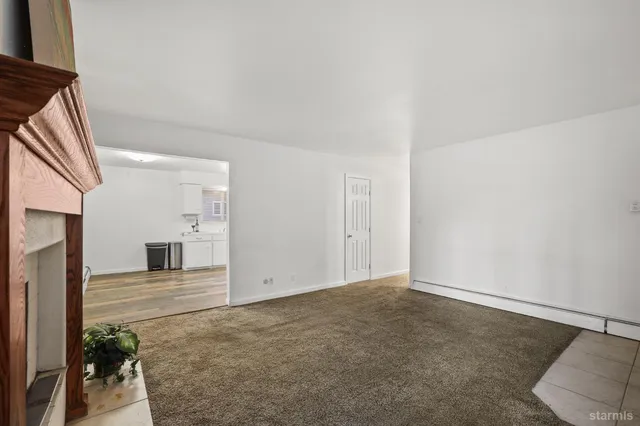 a kitchen with a white cabinets and white appliances