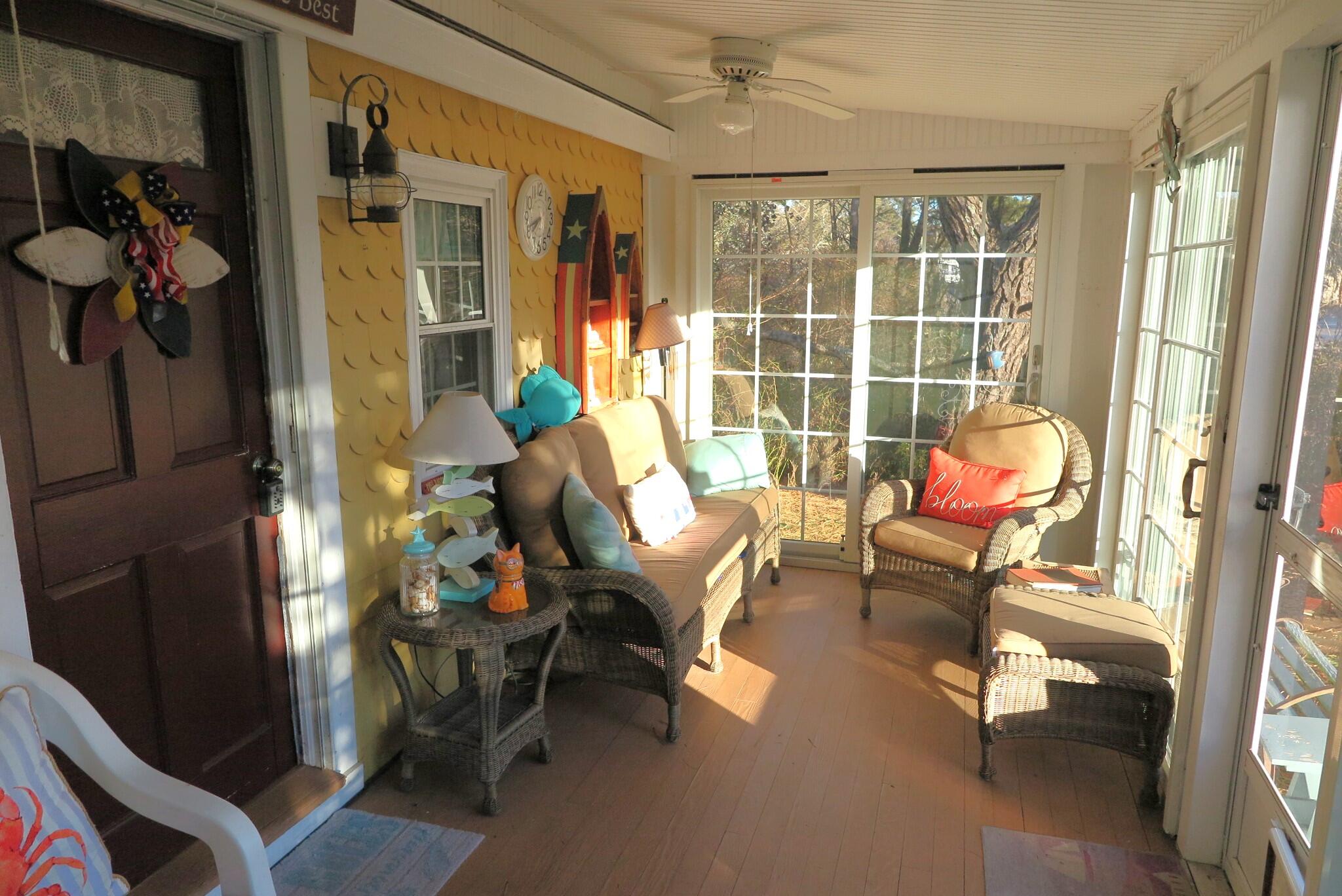 50 Lower County Road Dennis Port, MA 02639 - Photo 15 of 28 a living room with furniture and a window