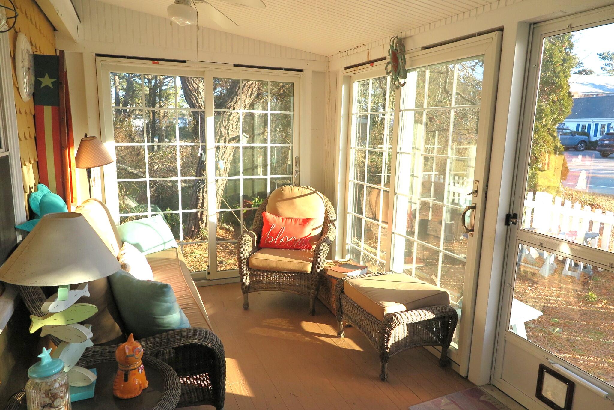 50 Lower County Road Dennis Port, MA 02639 - Photo 17 of 28 a living room with furniture and a window
