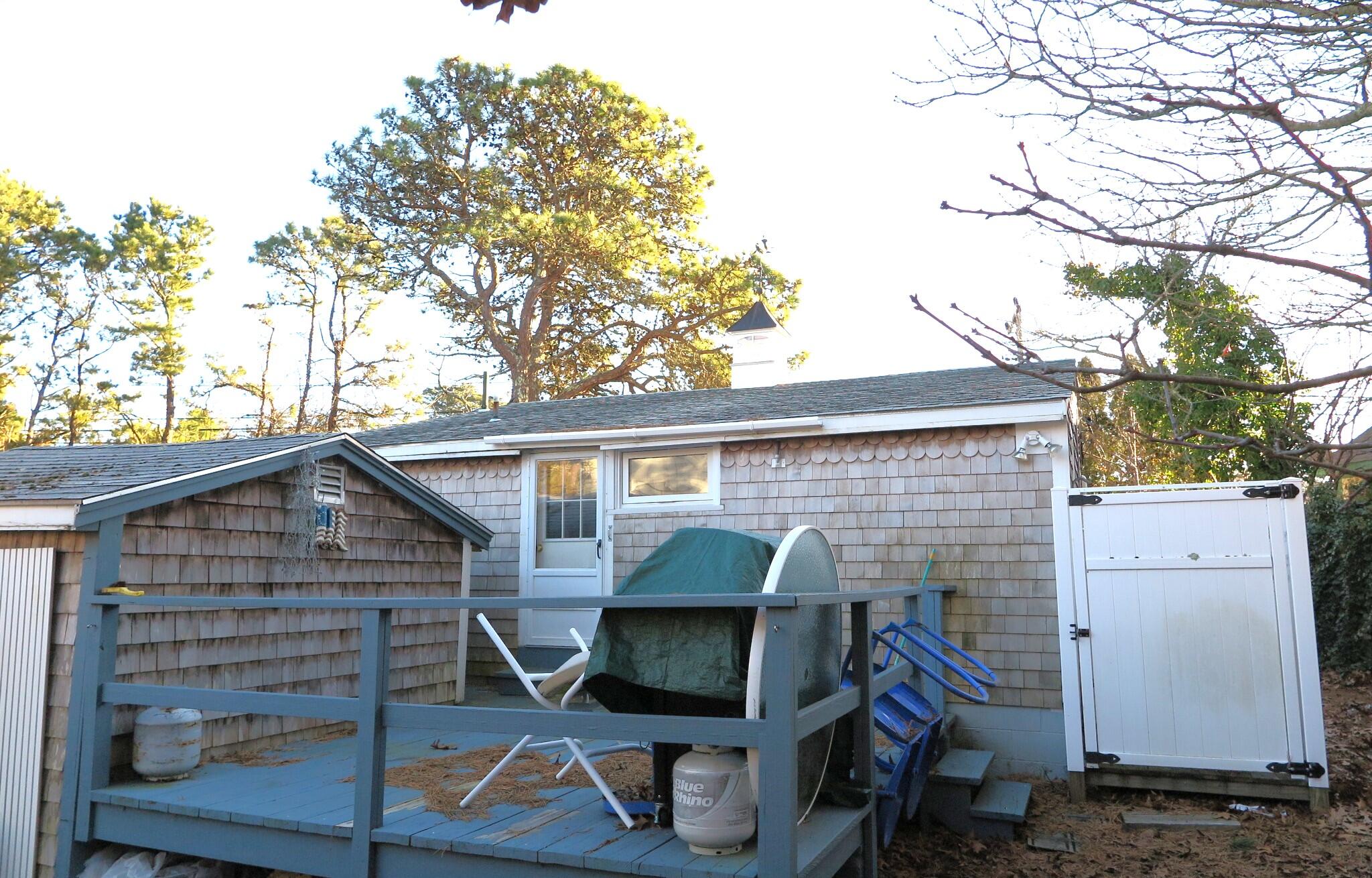 50 Lower County Road Dennis Port, MA 02639 - Photo 24 of 28 a view of house with a patio
