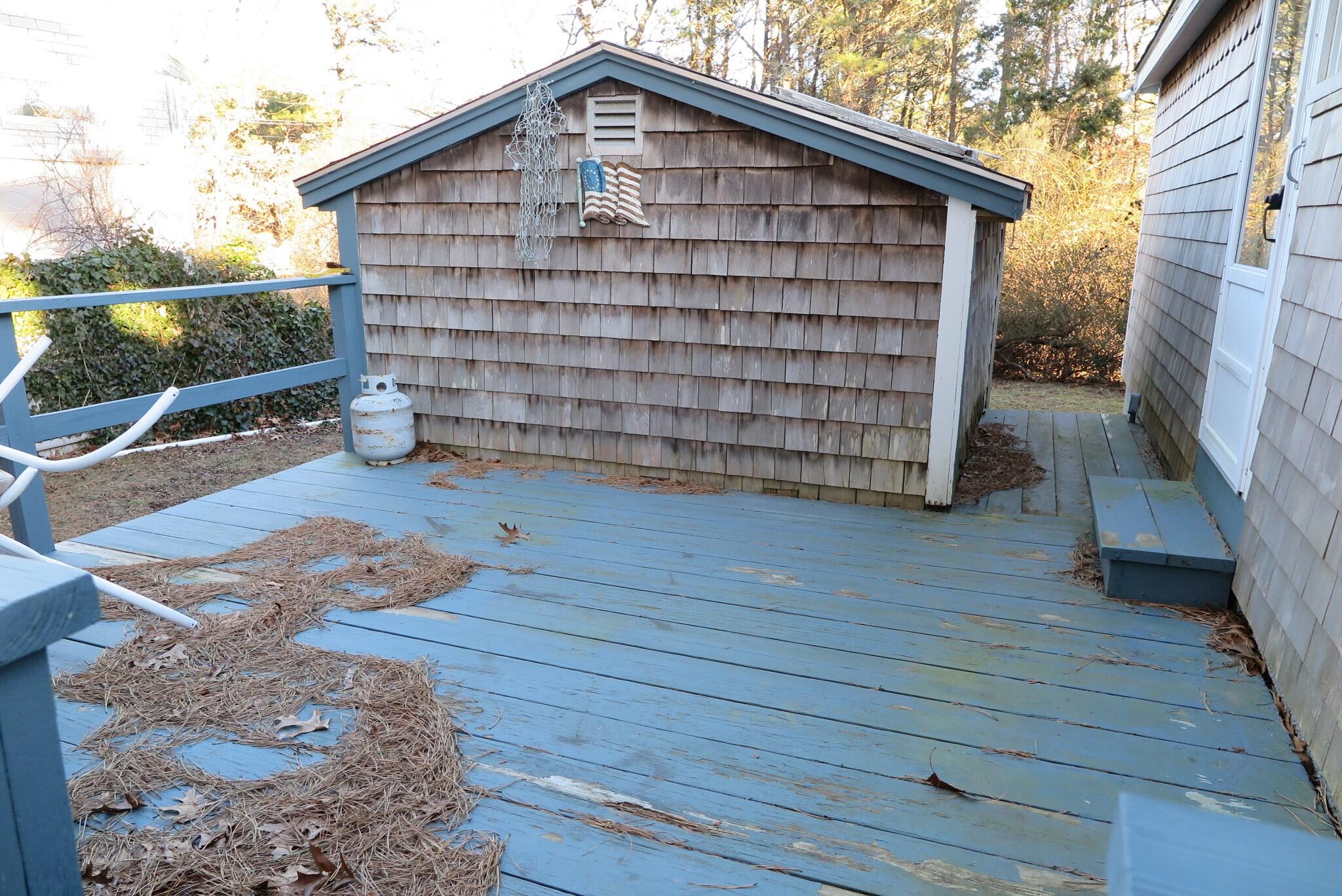 50 Lower County Road Dennis Port, MA 02639 - Photo 26 of 28 a front view of a house with wooden floor