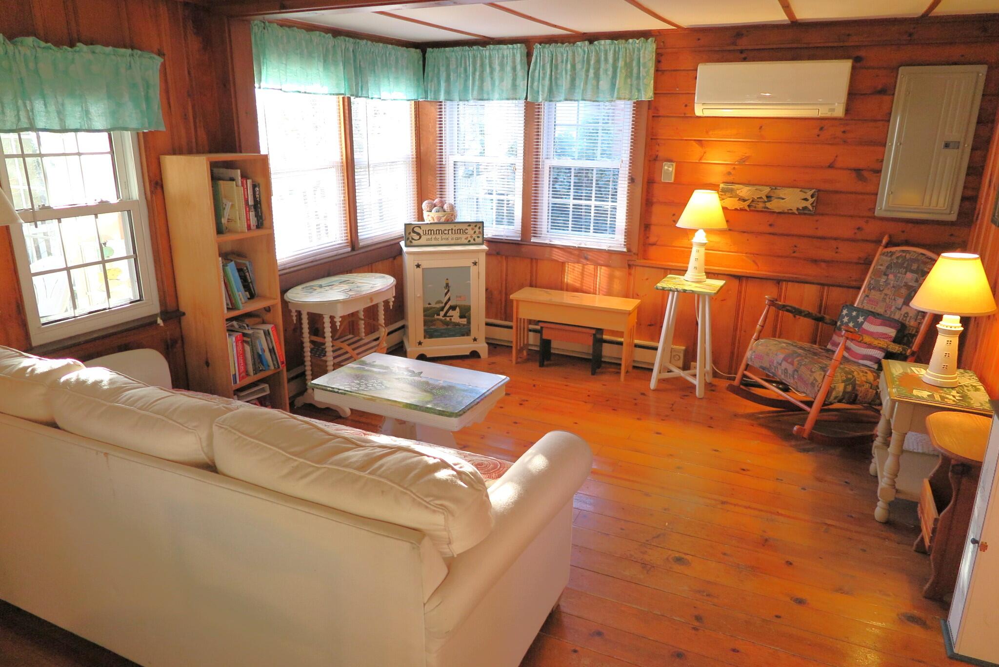 50 Lower County Road Dennis Port, MA 02639 - Photo 3 of 28 a living room with furniture and a large window