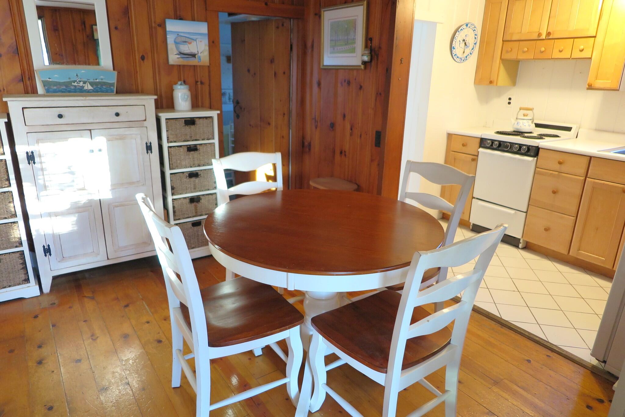 50 Lower County Road Dennis Port, MA 02639 - Photo 6 of 28 a dining room with furniture and wooden floor