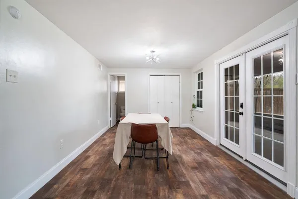 a spacious bedroom with a bed and a window