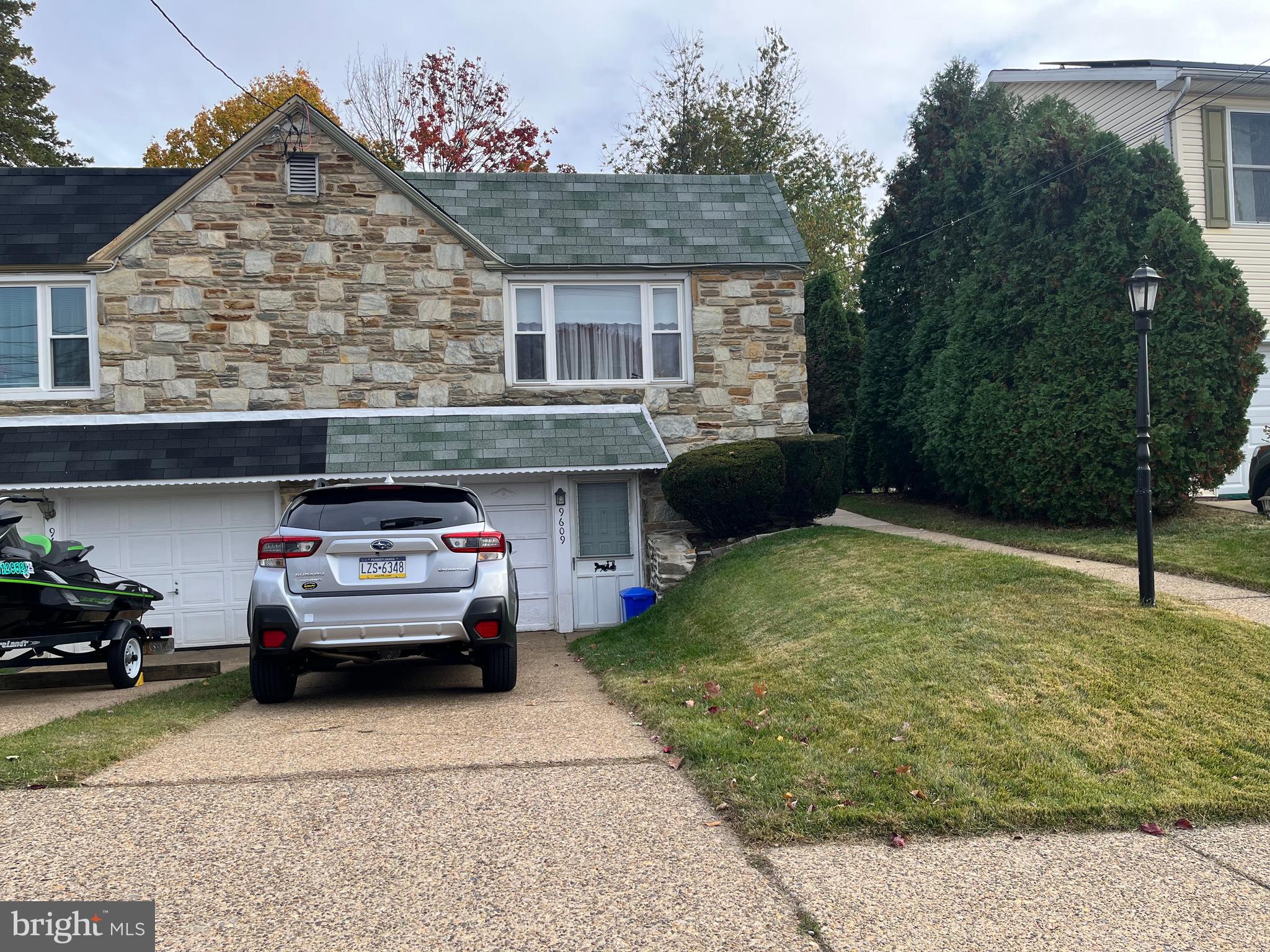a car parked in front of a house