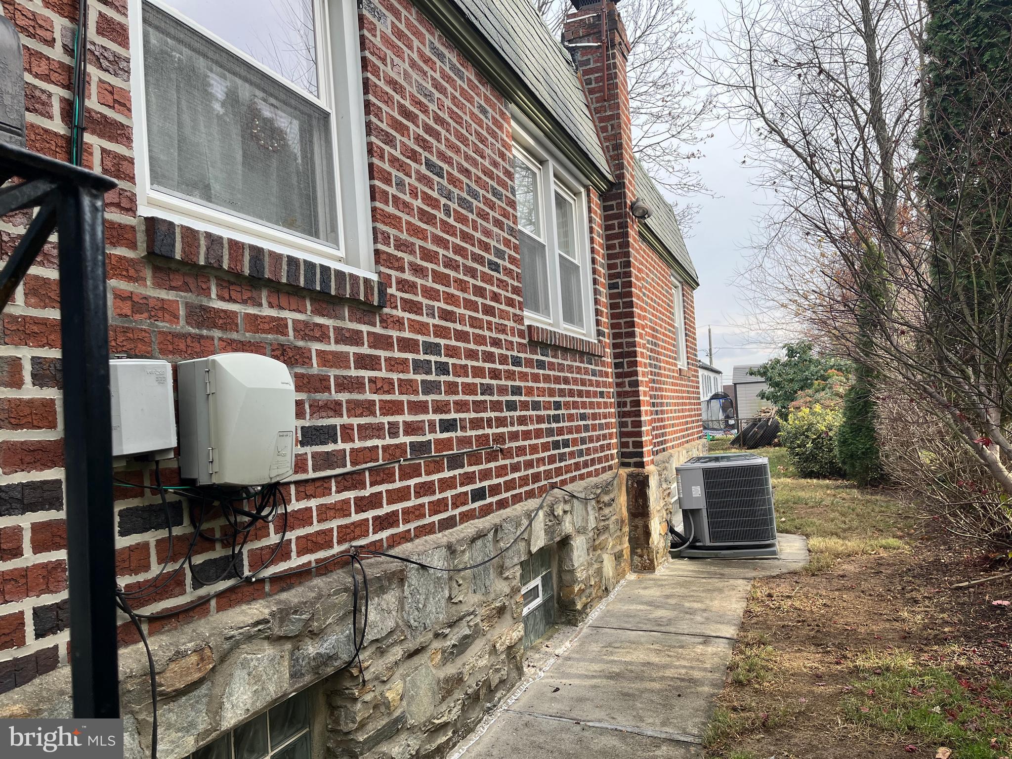 9609 Clark Street Philadelphia, PA 19115 - Photo 2 of 46 a brick building with a toilet and a chair
