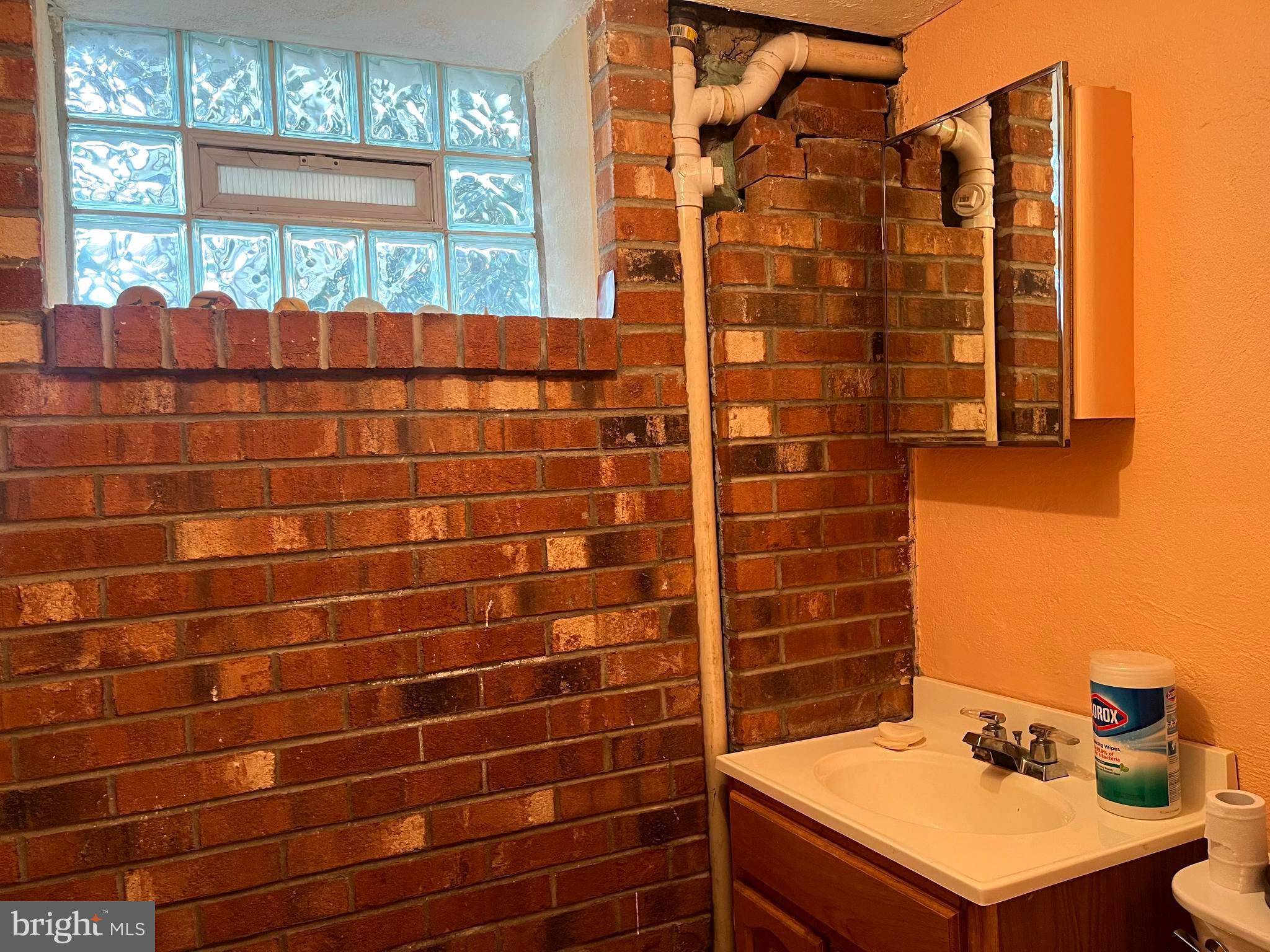 9609 Clark Street Philadelphia, PA 19115 - Photo 39 of 46 a bathroom with a sink toilet shower and a window