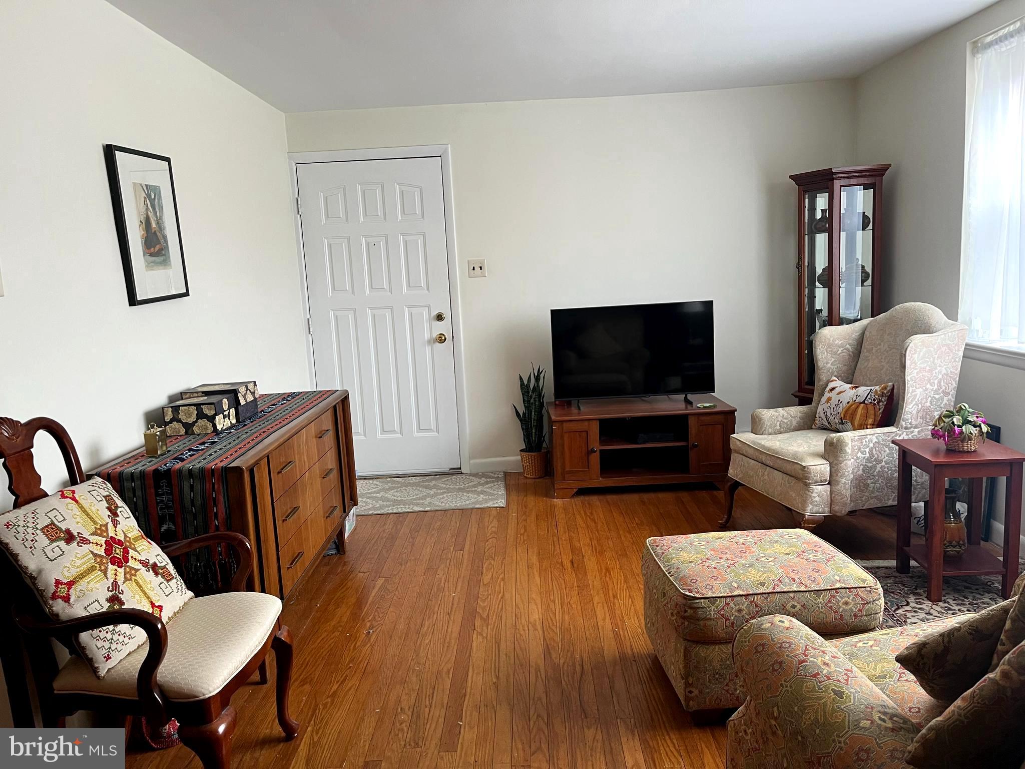 9609 Clark Street Philadelphia, PA 19115 - Photo 6 of 46 a living room with furniture and a flat screen tv