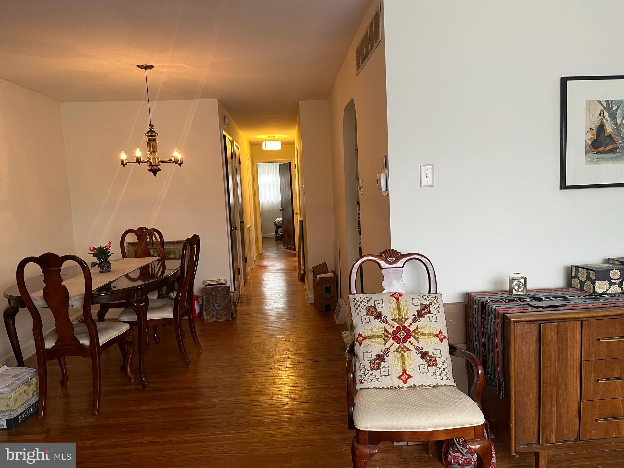 9609 Clark Street Philadelphia, PA 19115 - Photo 10 of 46 a dining room with furniture a chandelier and wooden floor