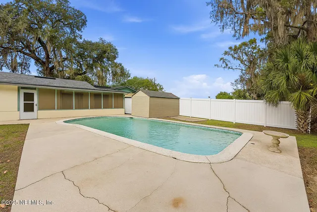 a view of a house with a swimming pool