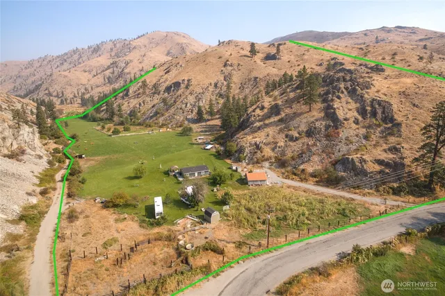 a view of a yard with a mountain