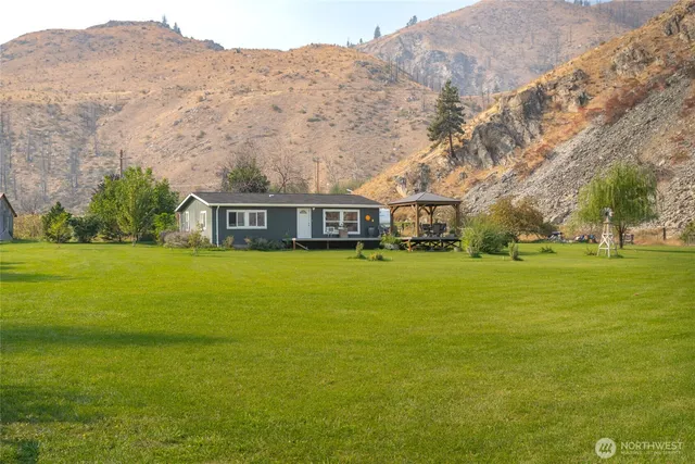a view of a house with a yard porch and sitting area