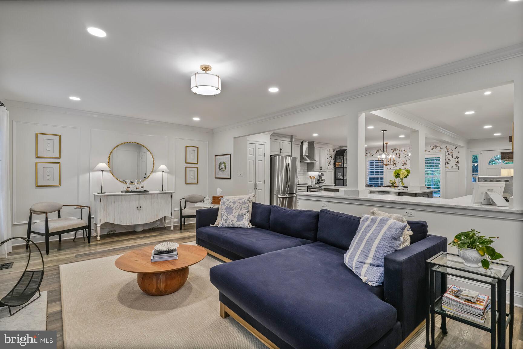 2327 North Glebe Road Arlington, VA 22207 - Photo 11 of 25 a living room with furniture kitchen and a chandelier