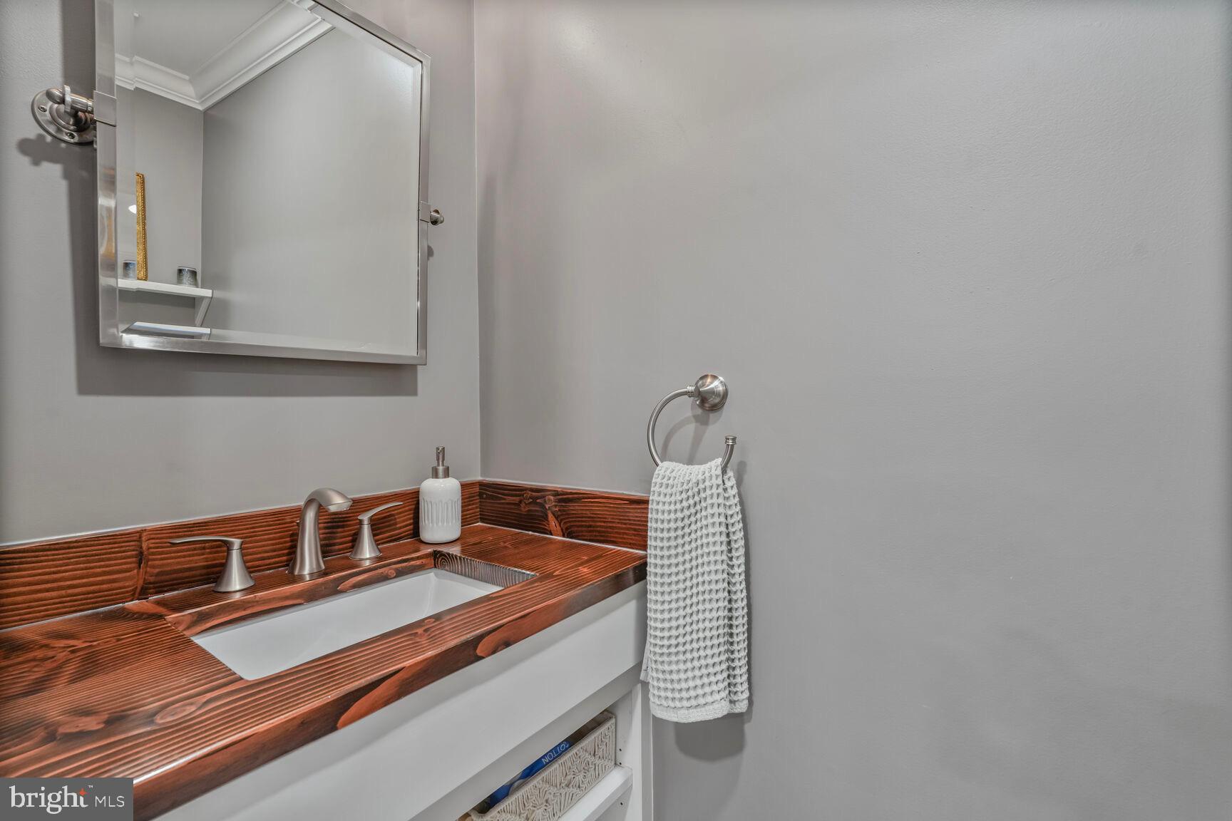 2327 North Glebe Road Arlington, VA 22207 - Photo 12 of 25 a bathroom with a sink and a mirror