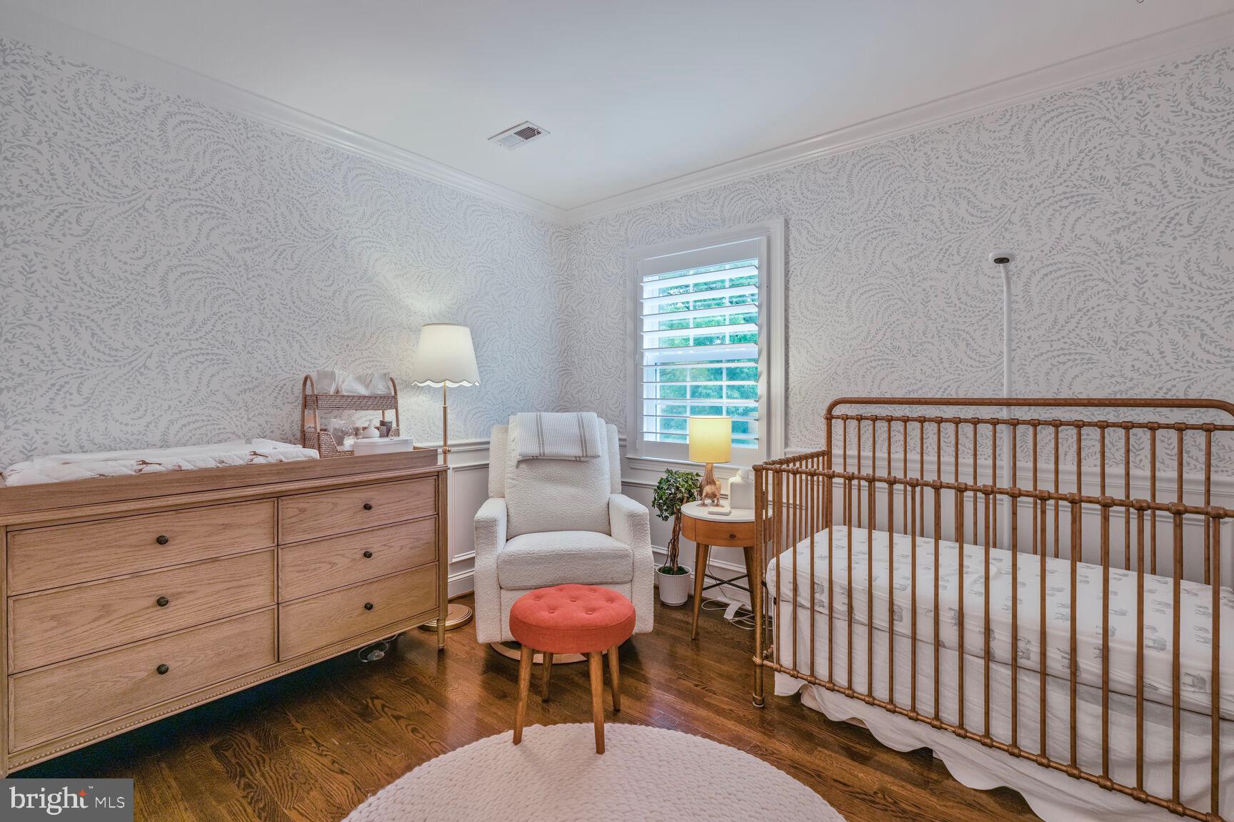 2327 North Glebe Road Arlington, VA 22207 - Photo 17 of 25 a bedroom with a bed and a dresser