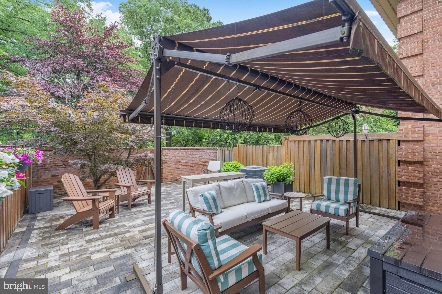 2327 North Glebe Road Arlington, VA 22207 - Photo 22 of 25 a view of patio with a table and chairs under an umbrella with a chair