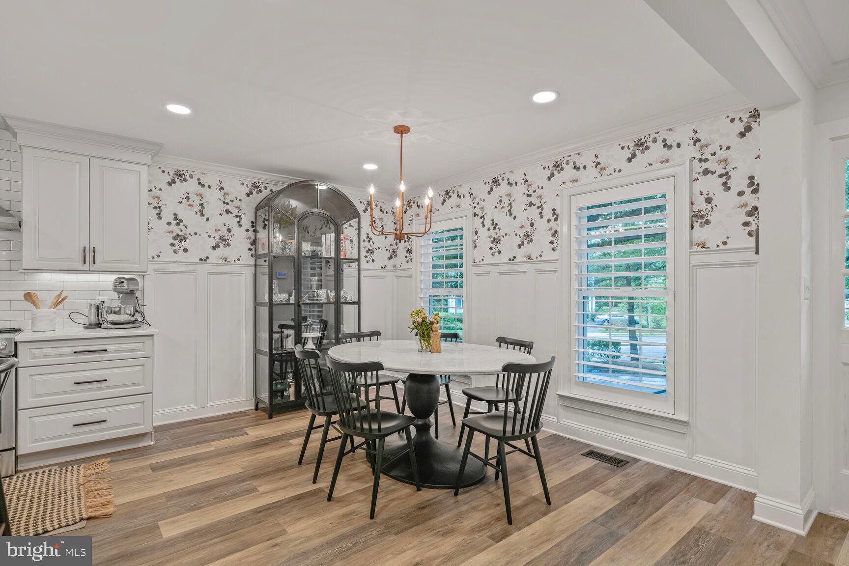 2327 North Glebe Road Arlington, VA 22207 - Photo 8 of 25 a view of a dining room with furniture and wooden floor