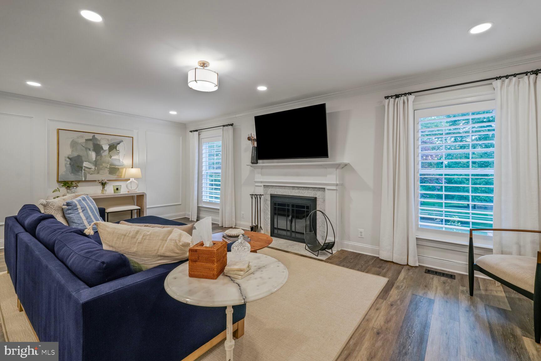 2327 North Glebe Road Arlington, VA 22207 - Photo 9 of 25 a living room with furniture fireplace and a flat screen tv