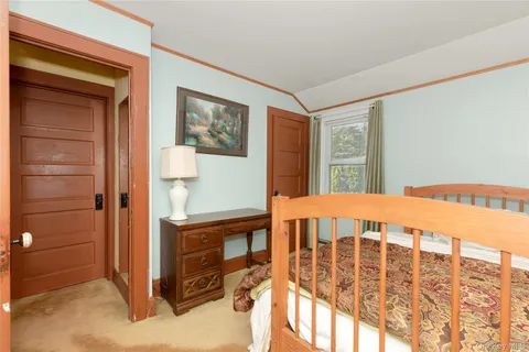 a bedroom with two beds and a window