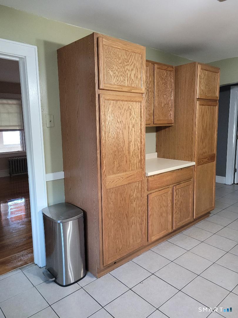103 Windsor Street Enfield, CT 06082 - Photo 20 of 22 a view of a kitchen with refrigerator and cabinet