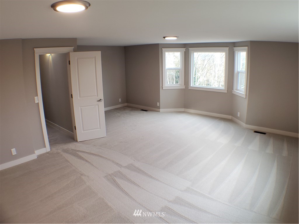 502 224 Place Southeast Bothell, WA 98021 - Photo 17 of 39 an empty room with windows and closet