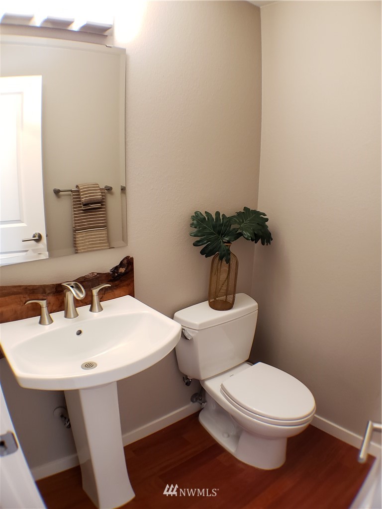 502 224 Place Southeast Bothell, WA 98021 - Photo 20 of 39 a white toilet sitting next to a bathroom sink