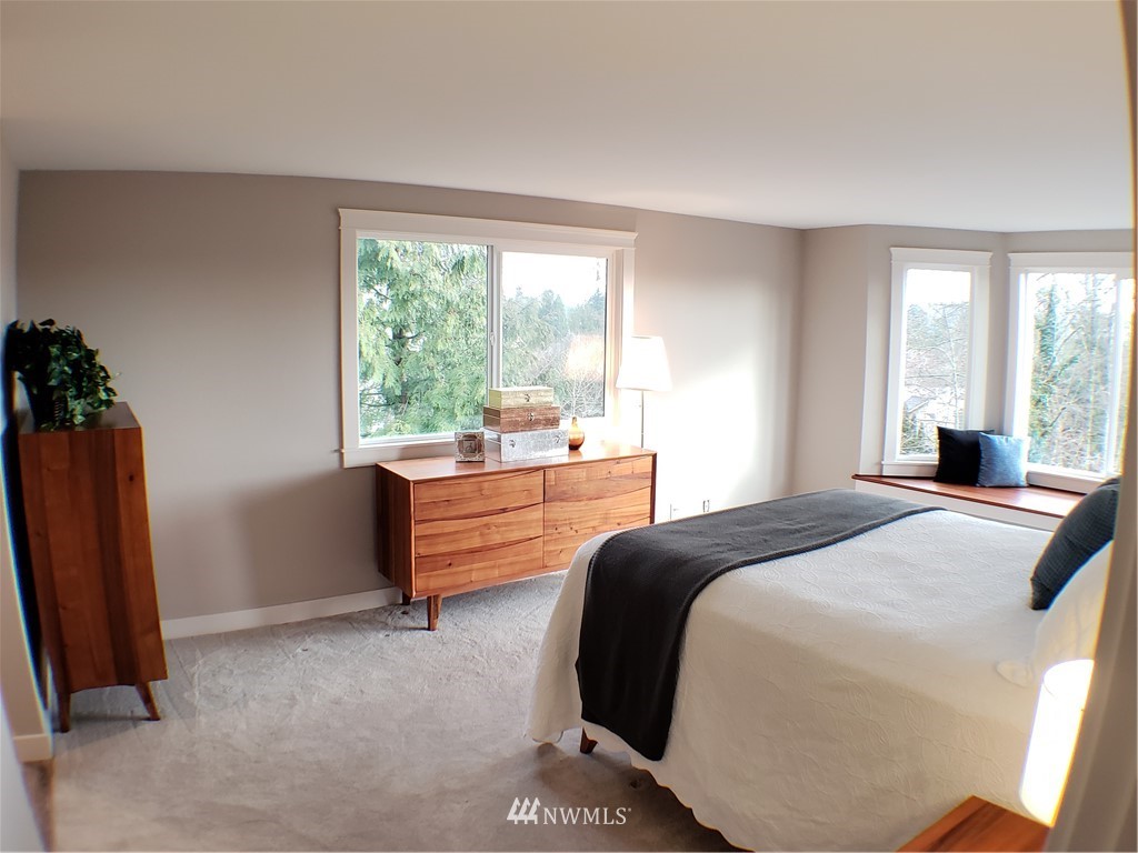 502 224 Place Southeast Bothell, WA 98021 - Photo 22 of 39 a bedroom with a bed and a large window