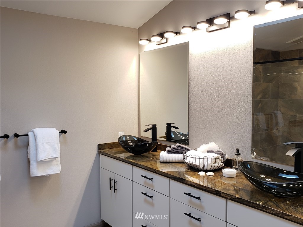 502 224 Place Southeast Bothell, WA 98021 - Photo 28 of 39 a bathroom with a granite countertop sink and a mirror
