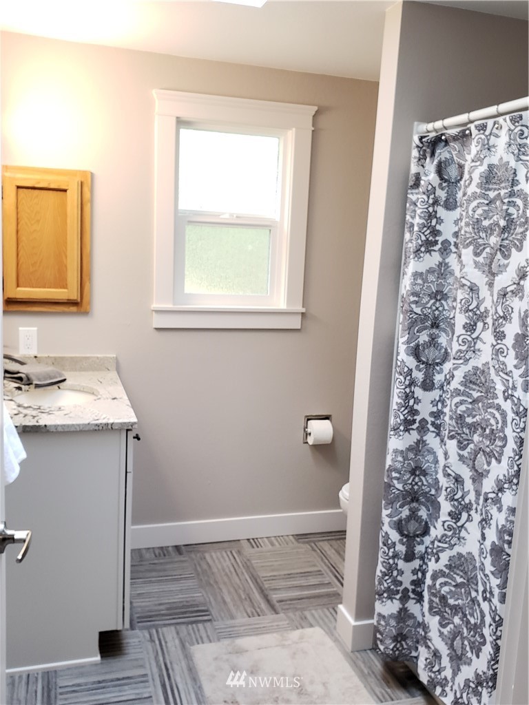 502 224 Place Southeast Bothell, WA 98021 - Photo 30 of 39 a bathroom with a sink and a toilet