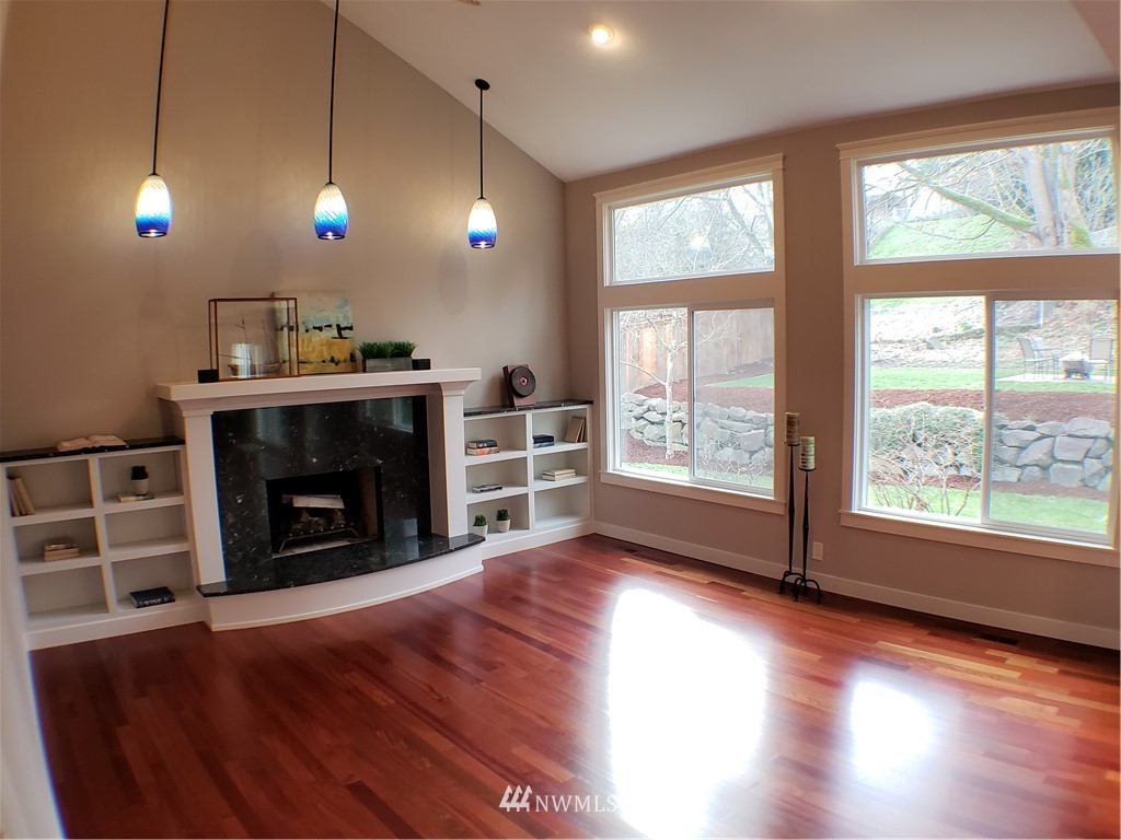 502 224 Place Southeast Bothell, WA 98021 - Photo 5 of 39 a view of a livingroom with furniture fire place and windows