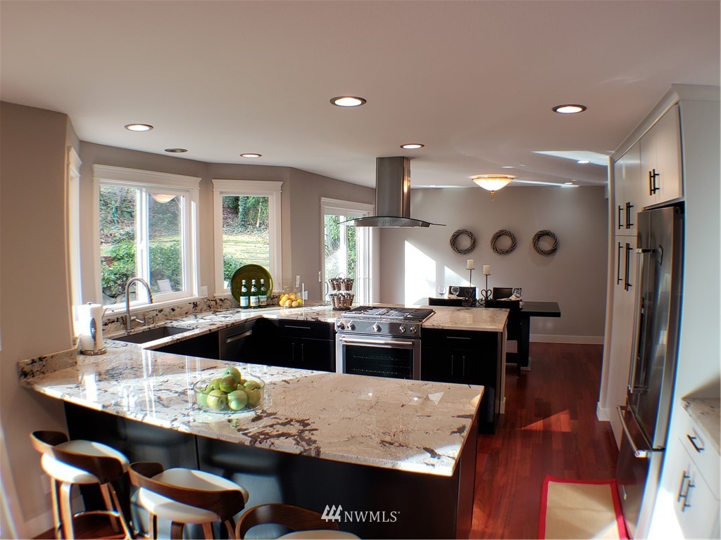 502 224 Place Southeast Bothell, WA 98021 - Photo 10 of 39 a large kitchen with a table and chairs