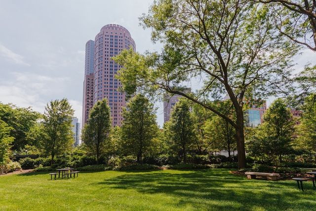 a view of a park with large trees