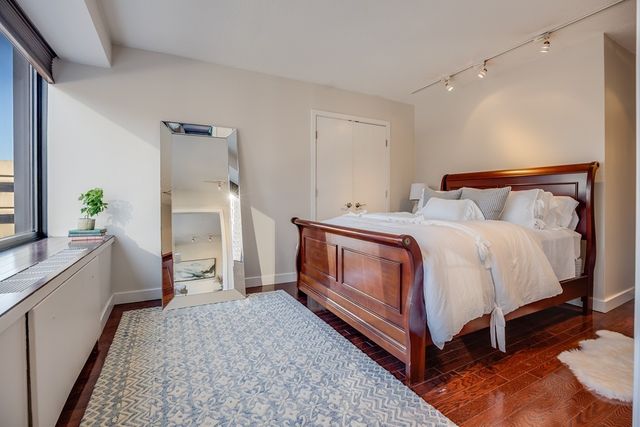 a bed room with a bed and a couch