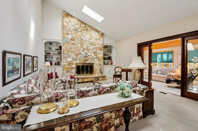 a living room with fireplace furniture and a flat screen tv