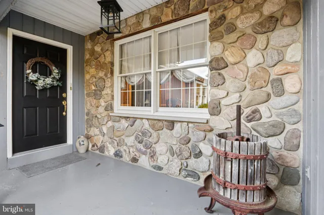a view of wooden door with a chair