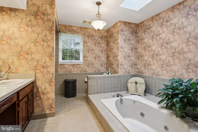 a bathroom with a sink double vanity and a mirror