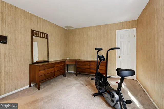 a picture of a room with furniture and a window