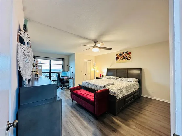 a bedroom with a bed couch and window