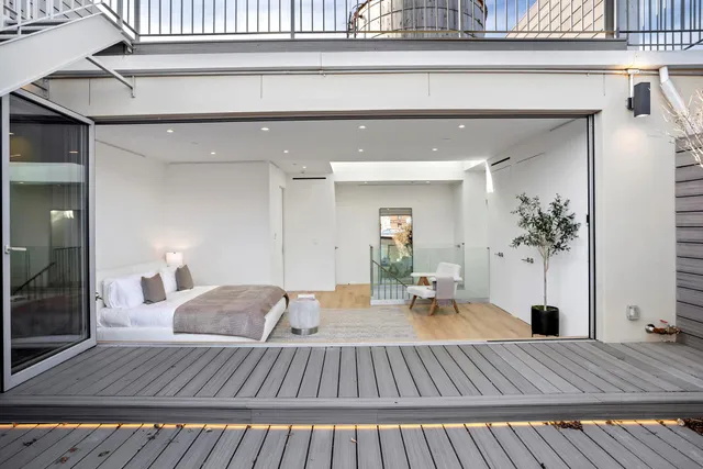 a view of roof deck with patio