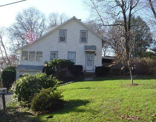 9 Cedar Road Westport, CT 06880 - Photo 1 of 1 a view of a house with a yard and a garden