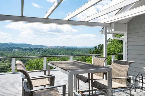 a view of a patio with a table chairs and a table