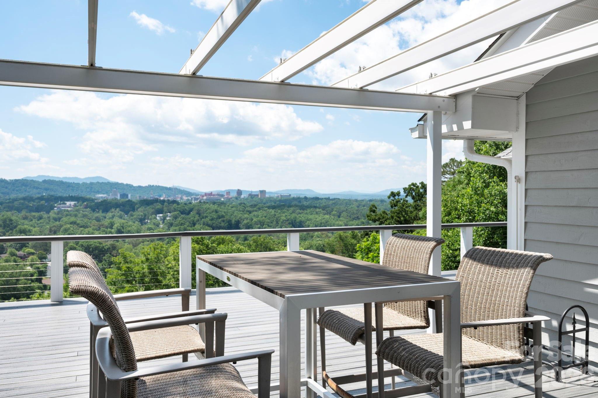 a view of a patio with a table chairs and a table