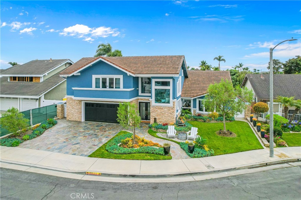 5522 Mossvale Circle Huntington Beach, CA 92649 - Photo 58 of 61 Architectural glass, stacked stone, and manicured flagstone entry.