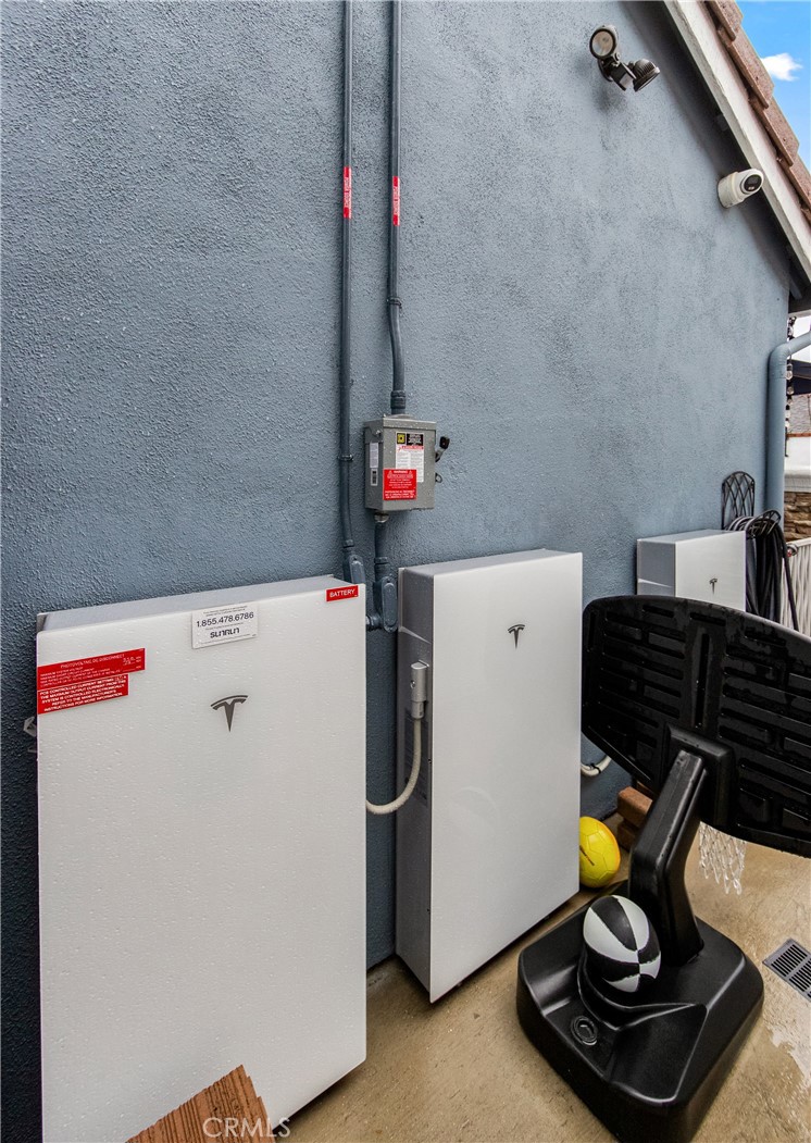 5522 Mossvale Circle Huntington Beach, CA 92649 - Photo 59 of 61 Solar system with Tesla battery storage for efficiency and peace of mind.