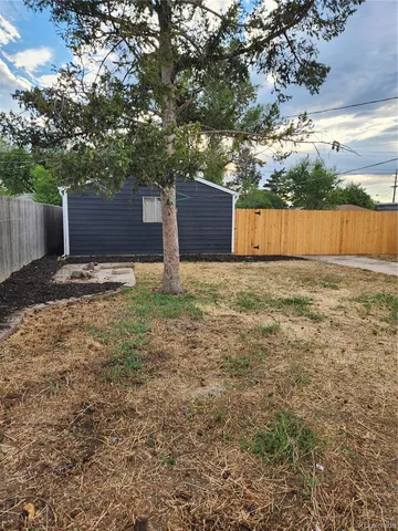 a backyard of a house with lots of green space