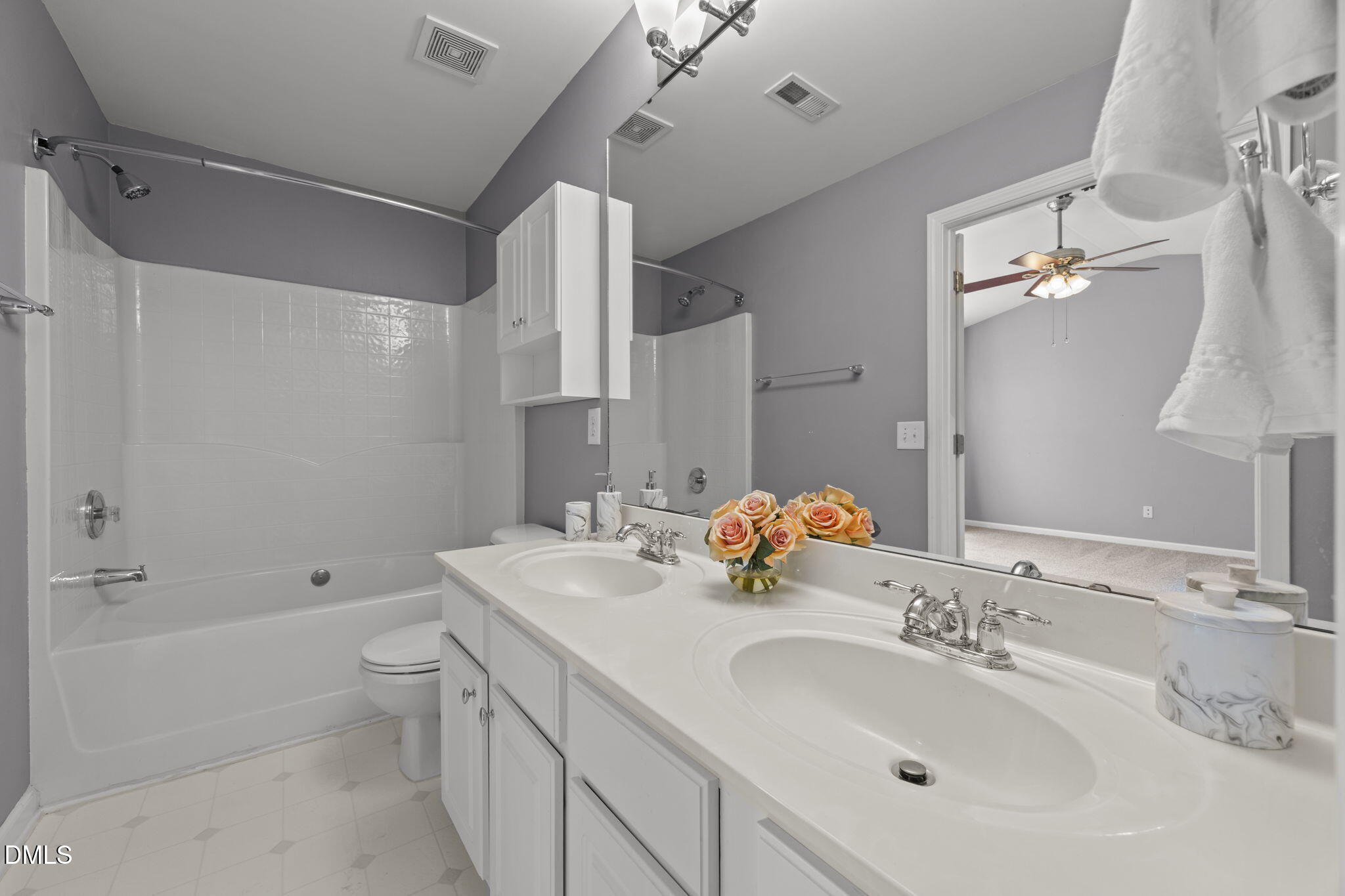 5537 Red Robin Road Raleigh, NC 27613 - Photo 15 of 33 a bathroom with a double vanity sink mirror double and bathtub
