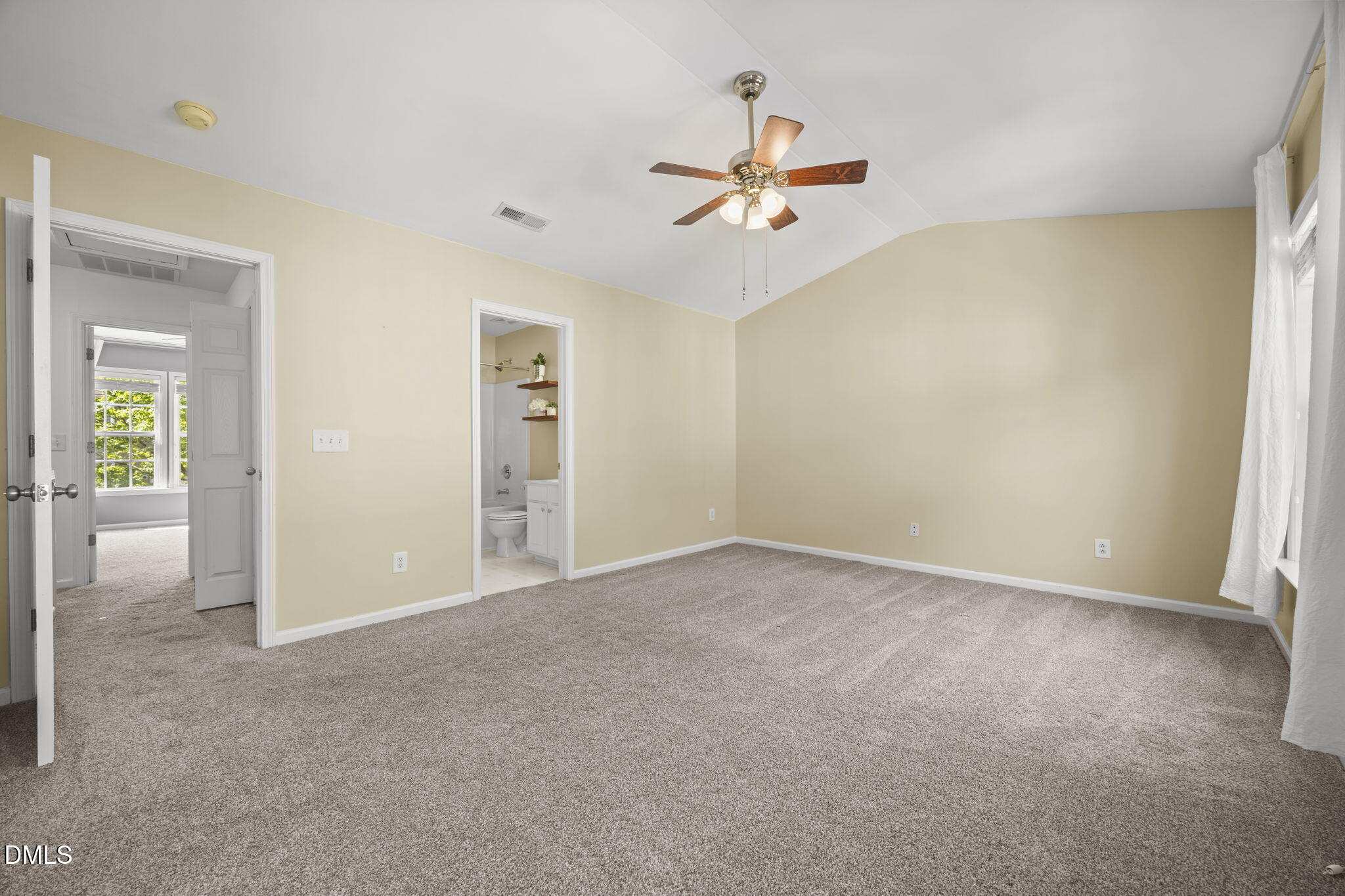 5537 Red Robin Road Raleigh, NC 27613 - Photo 17 of 33 an empty room that has a chandelier fan and wooden floor