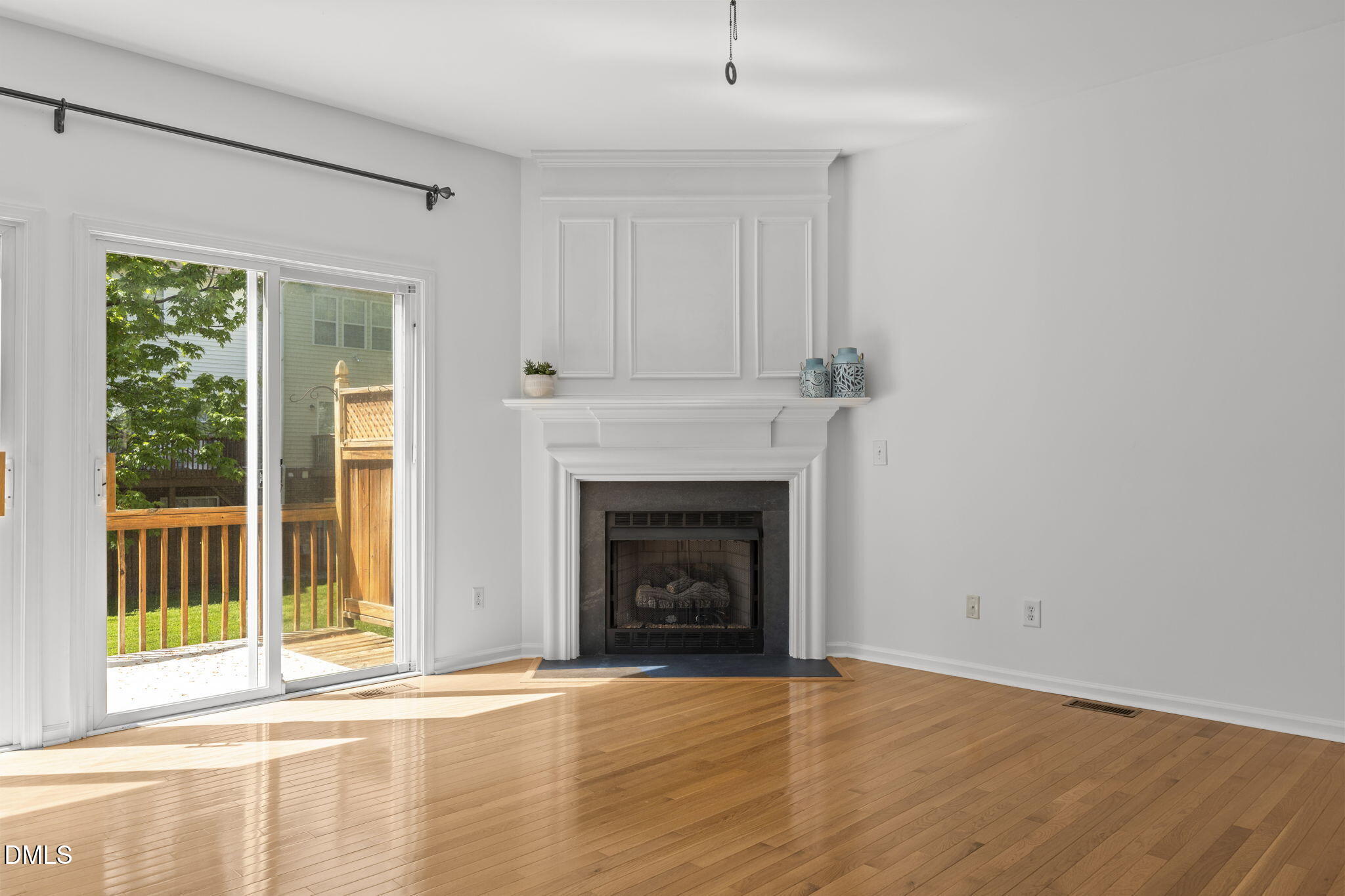 5537 Red Robin Road Raleigh, NC 27613 - Photo 7 of 33 a view of an empty room with wooden floor and a window
