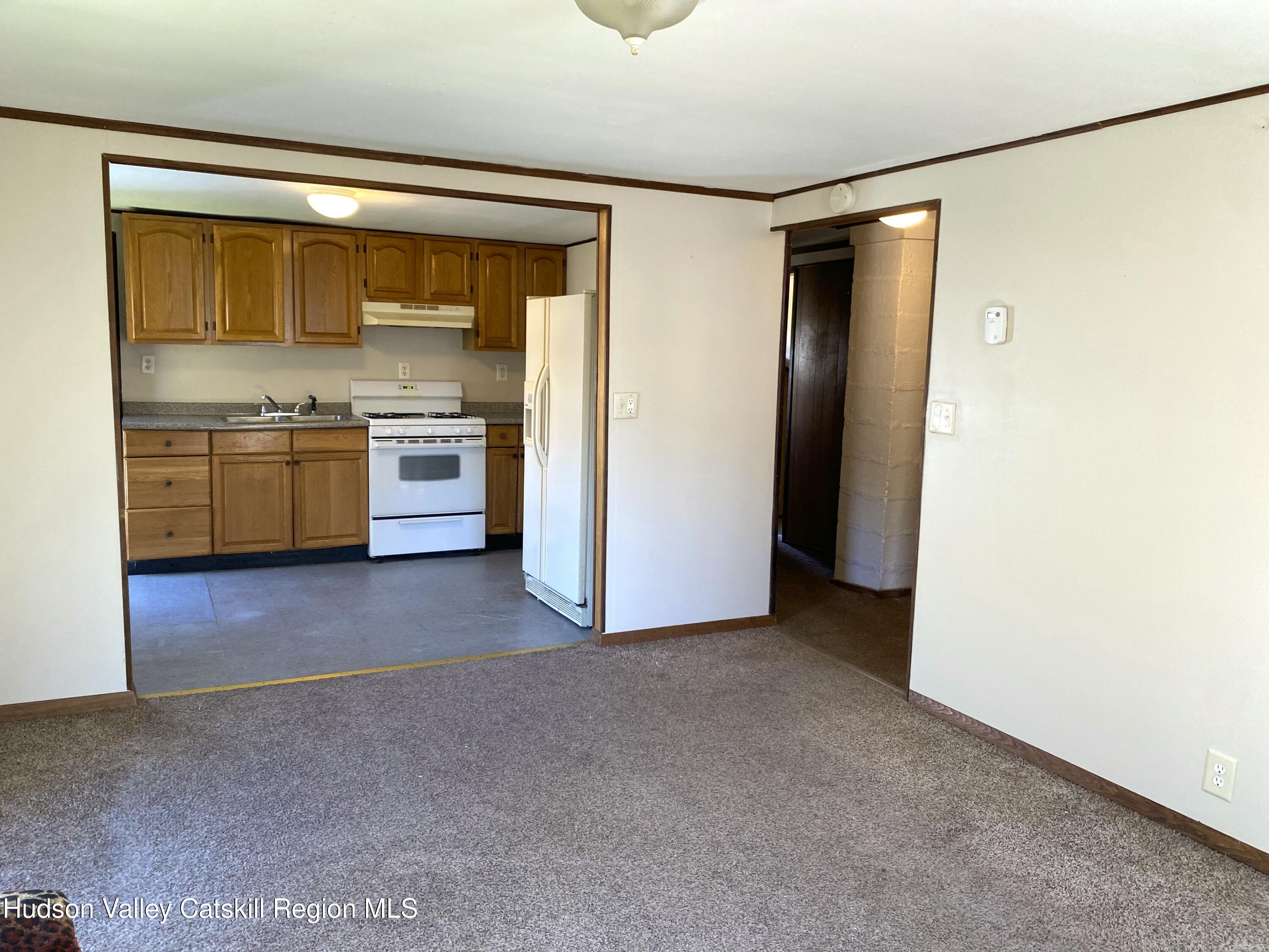53654 Highway 30 Roxbury, NY 12474 - Photo 11 of 18 a view of a kitchen with a sink and a refrigerator