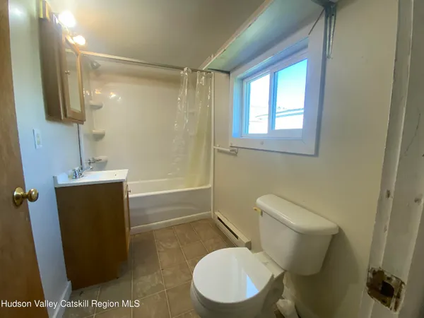 a bathroom with a toilet a sink and a shower